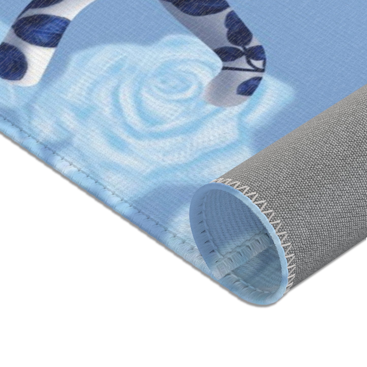 Area rug with cats, butterflies & roses motif on a blue background