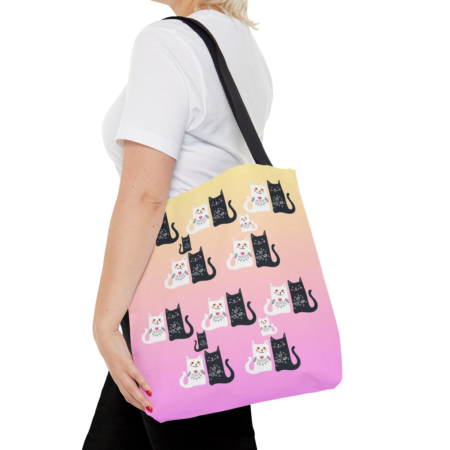 Black and White Cartoon cats design on a pink and yellow colored tote bag