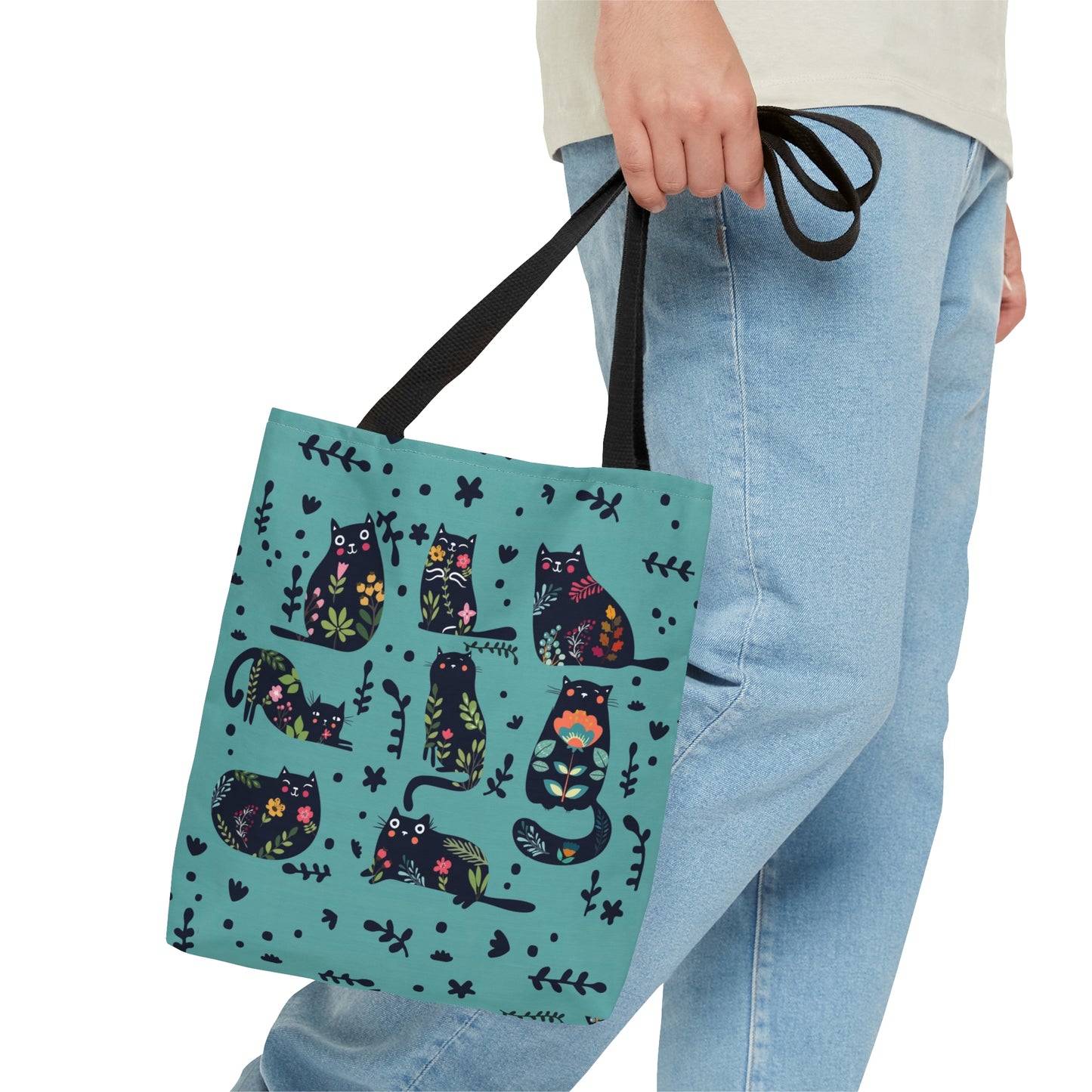 Blue Tote bag with black illustrated cats and flowers pattern.