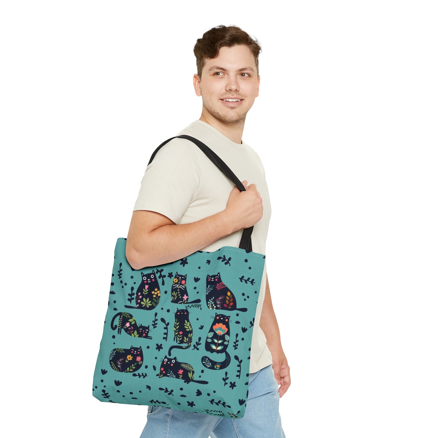 Blue Tote bag with black illustrated cats and flowers pattern.