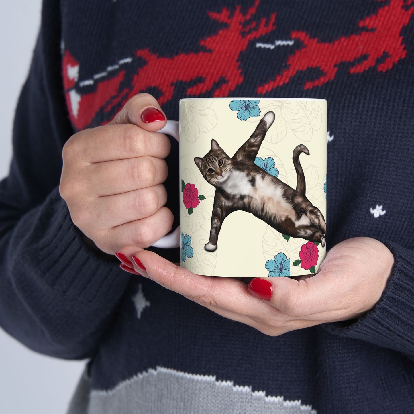 Mug with a cat in a yoga pose on a floral background.