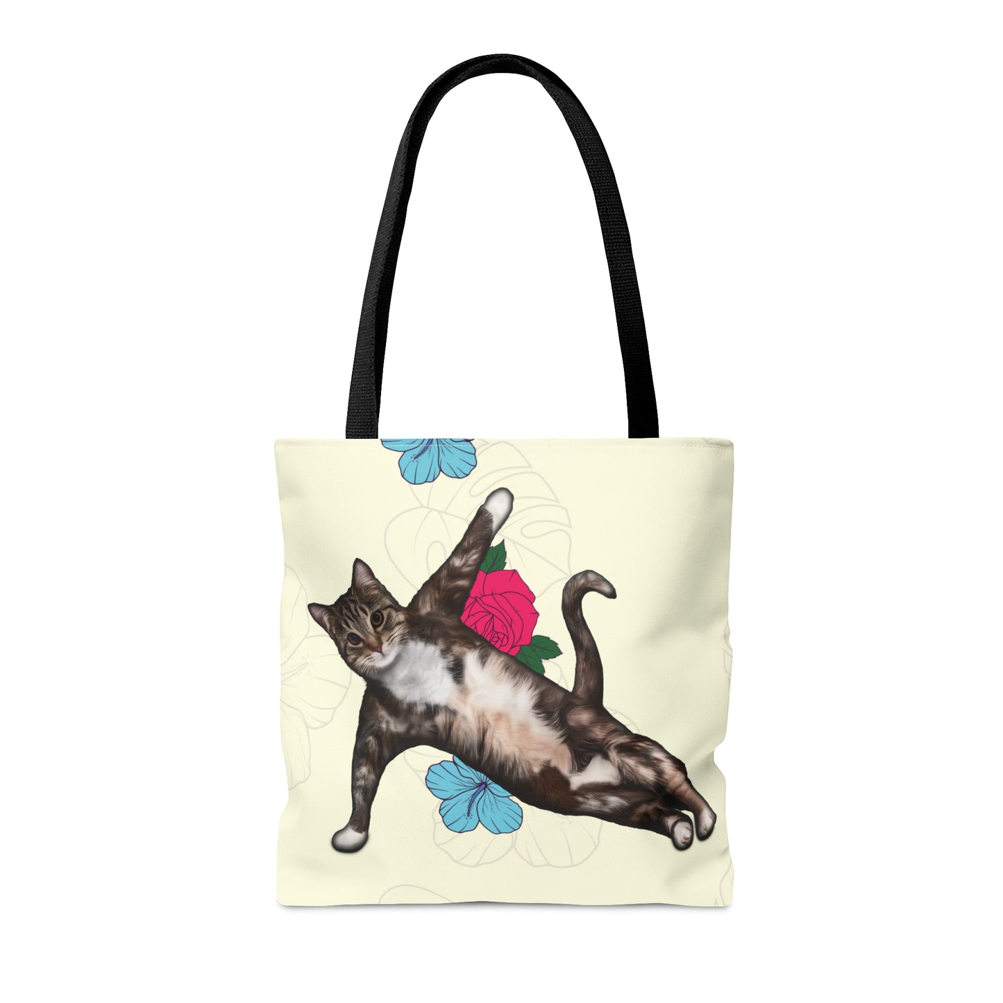 Tote bag with a cat in a yoga pose illustration against floral design on a cream background