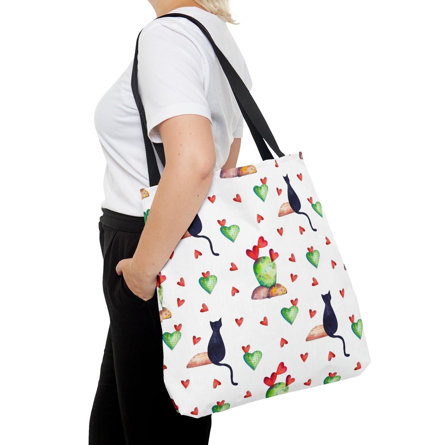 Tote bag with black cat, hearts and cactus pattern on a white background