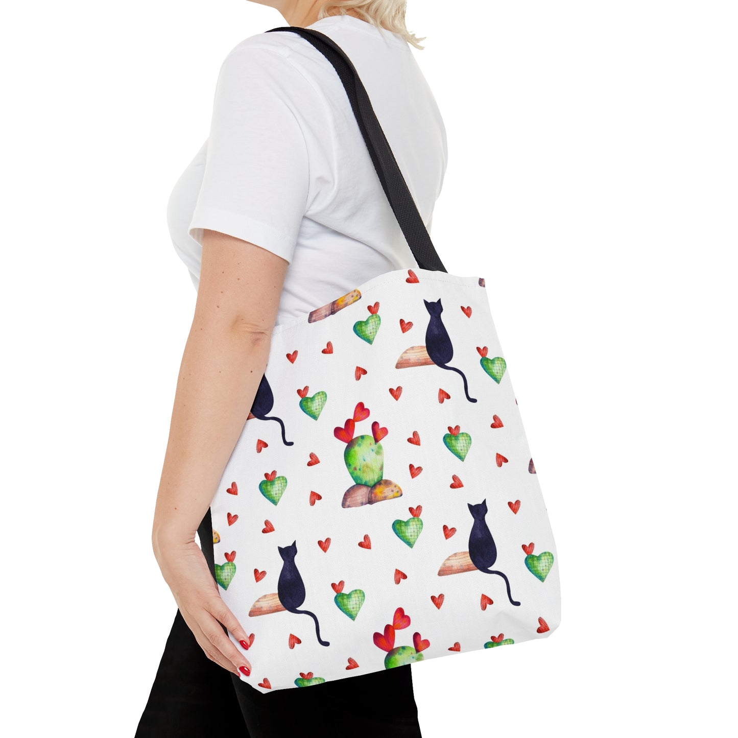 Tote bag with black cat, hearts and cactus pattern on a white background