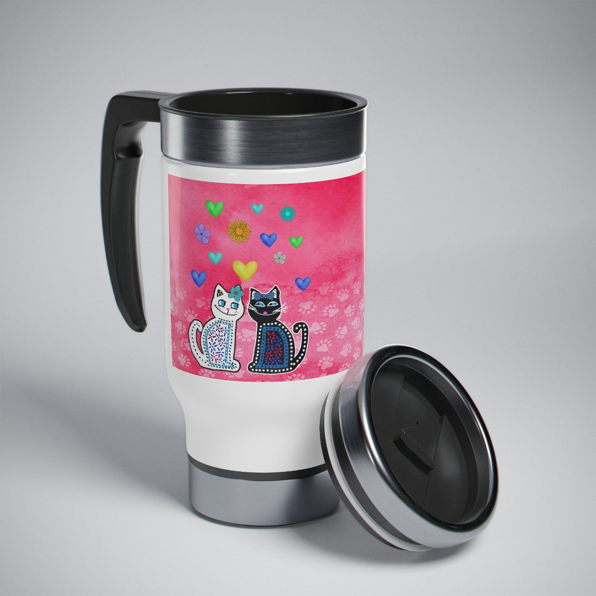 A 14oz stainless steel and plastic insulated travel mug with a cat theme. white and black cat and hearts design, including a handle and a spill resistant screw-on cap.