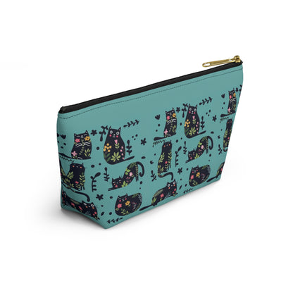 An accessory bag with an abstract design featuring cats and floral design on a blue background. Cosmetic, makeup, toiletry, travel, pencil case & everyday bag for cat lovers.