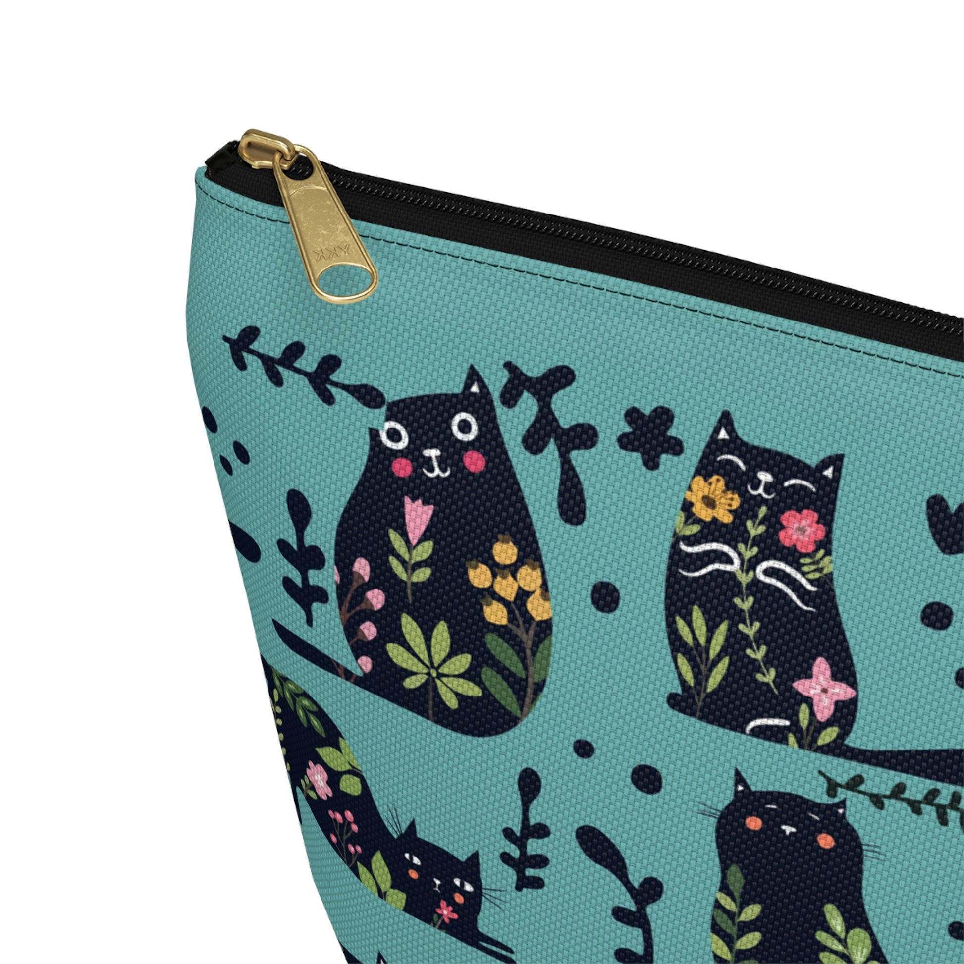 An accessory bag with an abstract design featuring cats and floral design on a blue background. Cosmetic, makeup, toiletry, travel, pencil case & everyday bag for cat lovers.