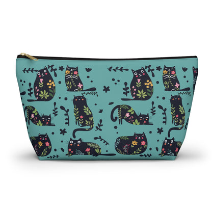 An accessory bag with an abstract design featuring cats and floral design on a blue background. Cosmetic, makeup, toiletry, travel, pencil case & everyday bag for cat lovers.