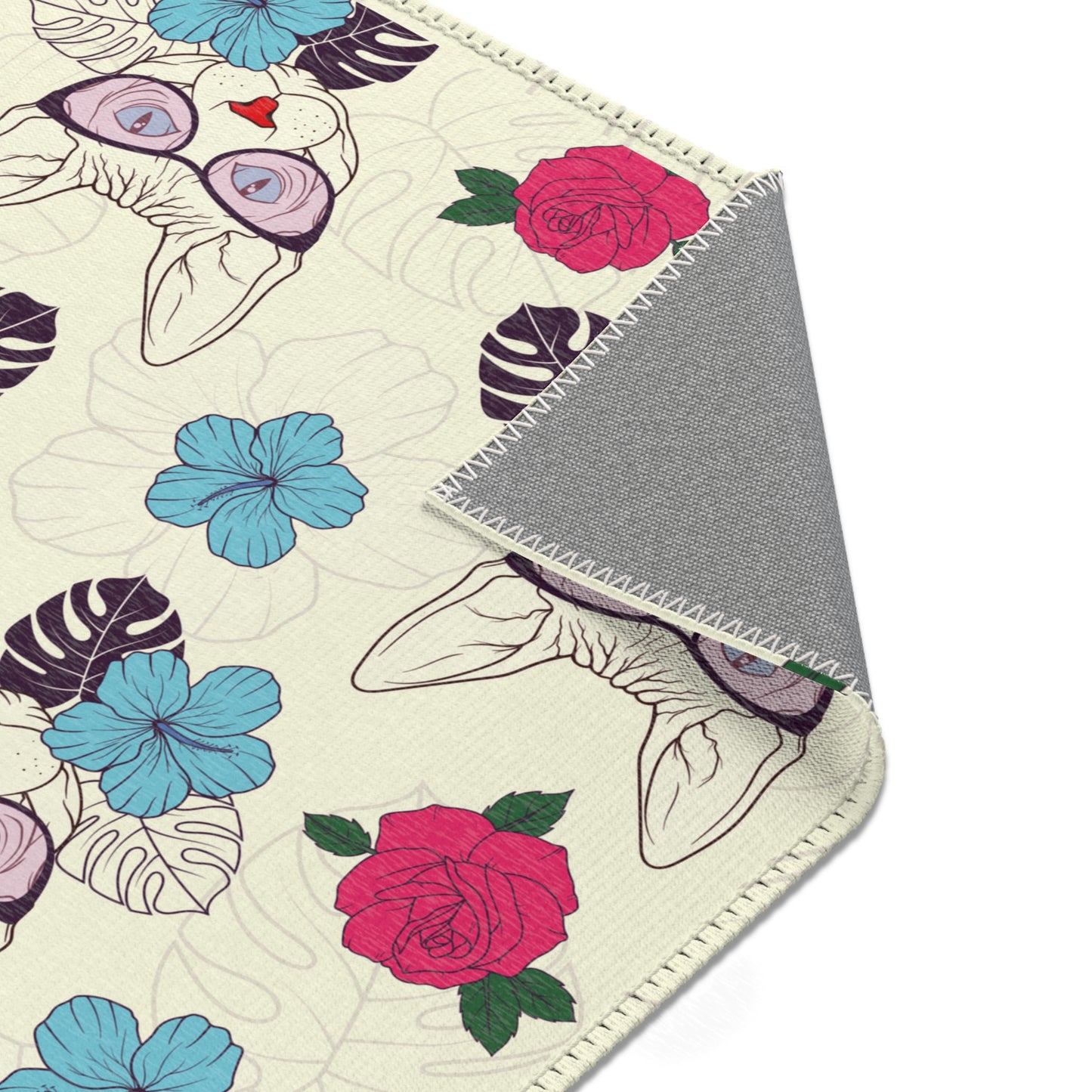 Area rug with a pattern of cartoon Sphynx cats and tropical flowers on a cream background
