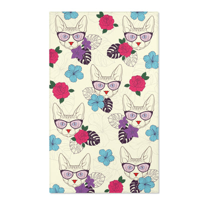 Area rug with a pattern of cartoon Sphynx cats and tropical flowers on a cream background
