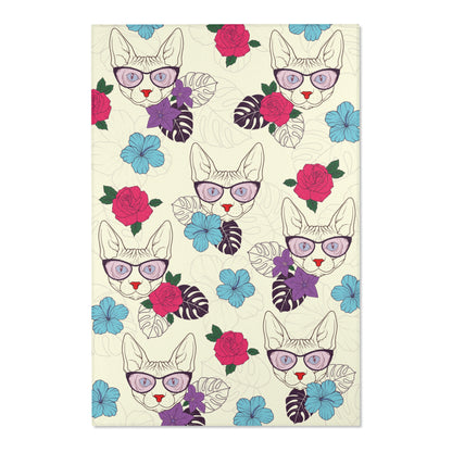 Area rug with a pattern of cartoon Sphynx cats and tropical flowers on a cream background