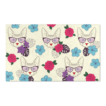 Area rug with a pattern of cartoon Sphynx cats and tropical flowers on a cream background