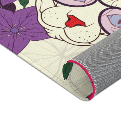Area rug with a pattern of cartoon Sphynx cats and tropical flowers on a cream background