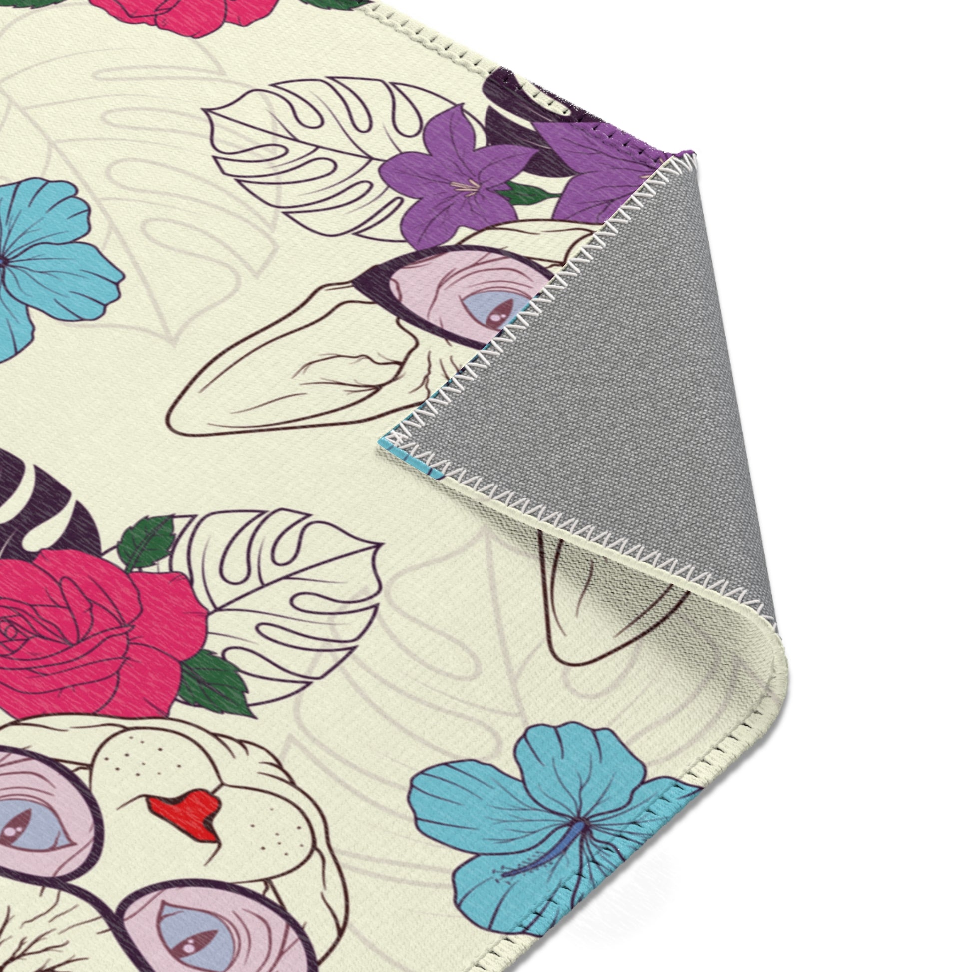 Area rug with a pattern of cartoon Sphynx cats and tropical flowers on a cream background