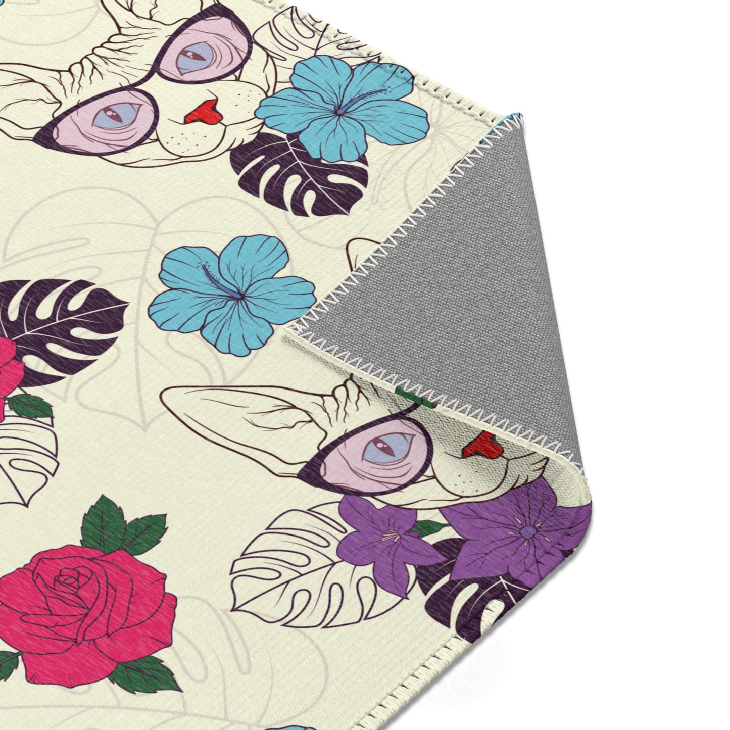 Area rug with a pattern of cartoon Sphynx cats and tropical flowers on a cream background