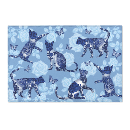 Area rug with cats, butterflies & roses motif on a blue background