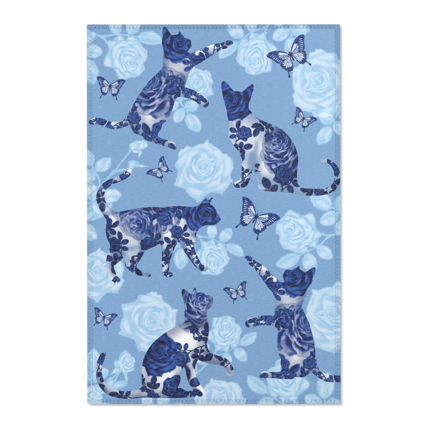Area rug with cats, butterflies & roses motif on a blue background