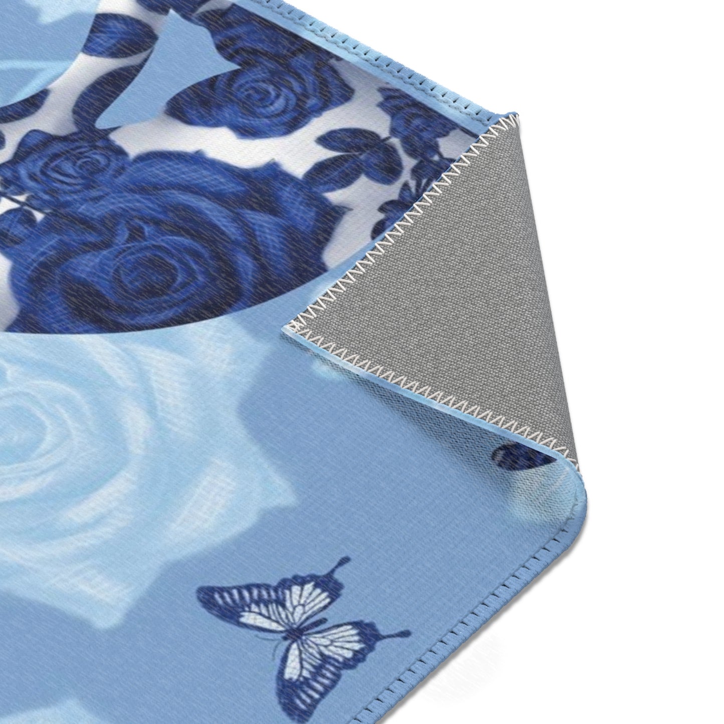 Area rug with cats, butterflies & roses motif on a blue background
