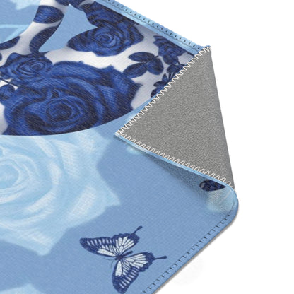 Area rug with cats, butterflies & roses motif on a blue background