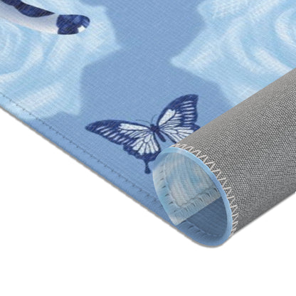 Area rug with cats, butterflies & roses motif on a blue background
