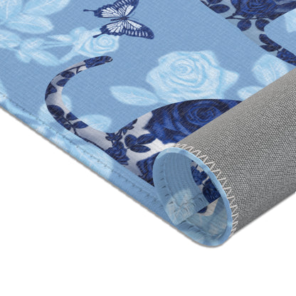 Area rug with cats, butterflies & roses motif on a blue background