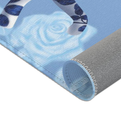 Area rug with cats, butterflies & roses motif on a blue background