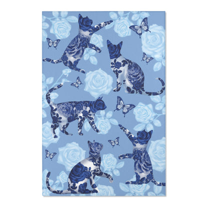 Area rug with cats, butterflies & roses motif on a blue background