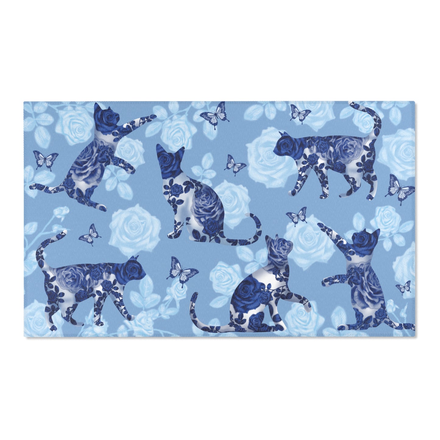 Area rug with cats, butterflies & roses motif on a blue background