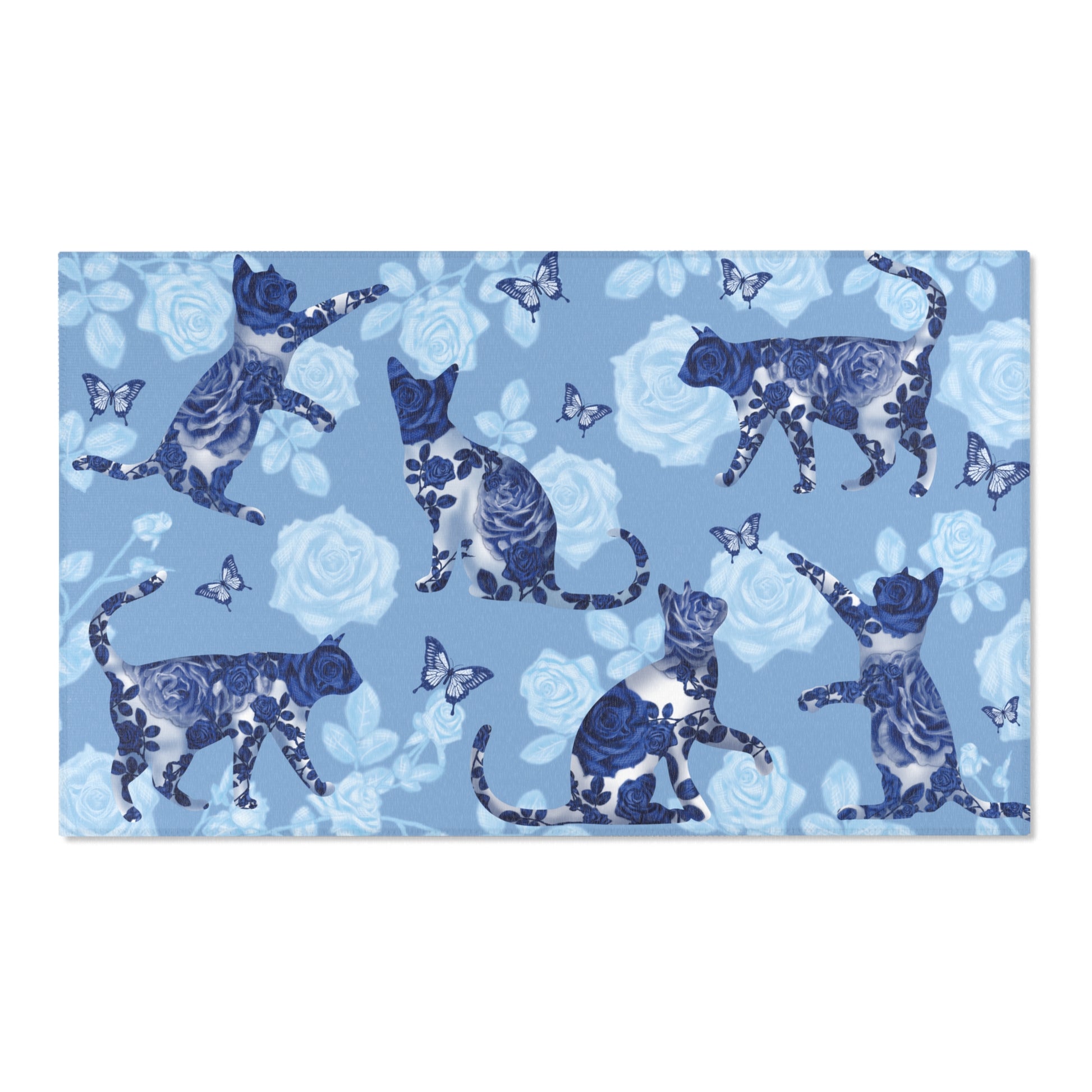 Area rug with cats, butterflies & roses motif on a blue background