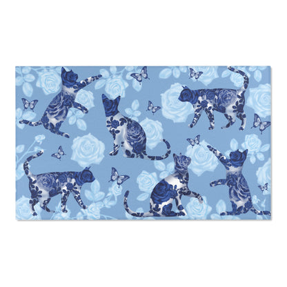 Area rug with cats, butterflies & roses motif on a blue background