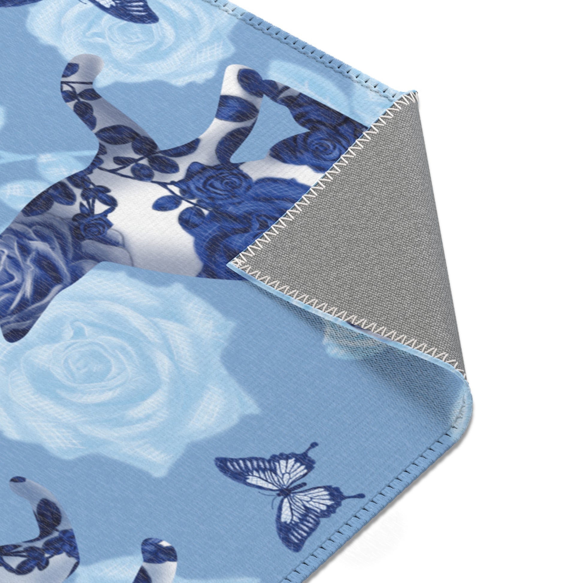 Area rug with cats, butterflies & roses motif on a blue background