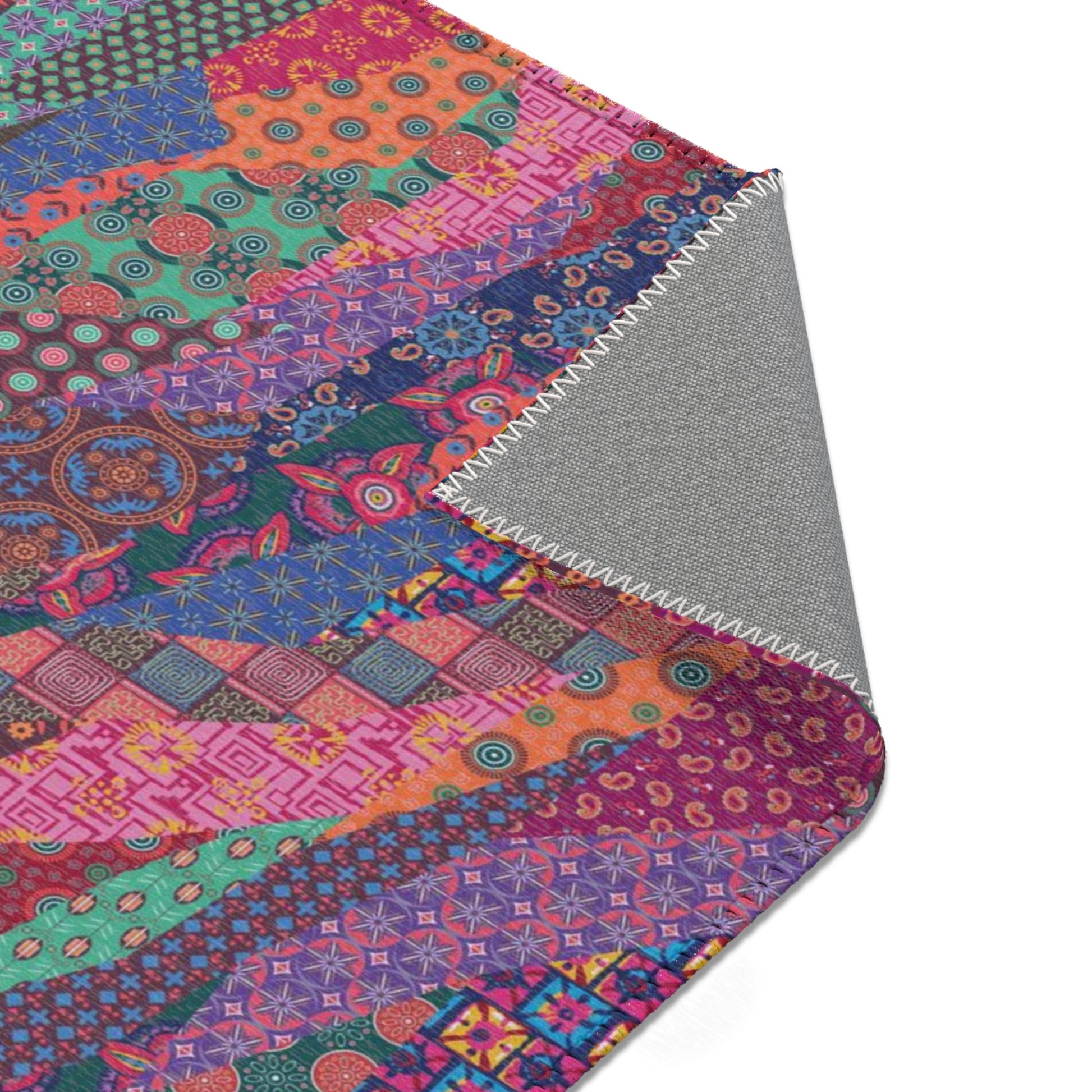 Area rug with colorful abstract cat design on a geometric patterned background