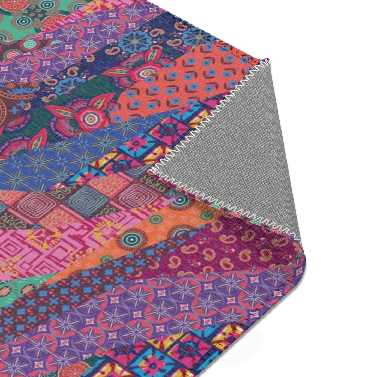 Area rug with colorful abstract cat design on a geometric patterned background