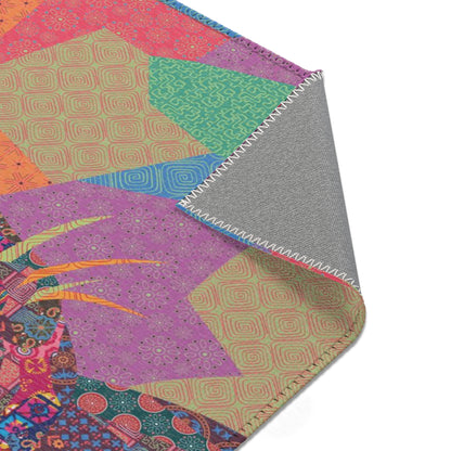 Area rug with colorful abstract cat design on a geometric patterned background