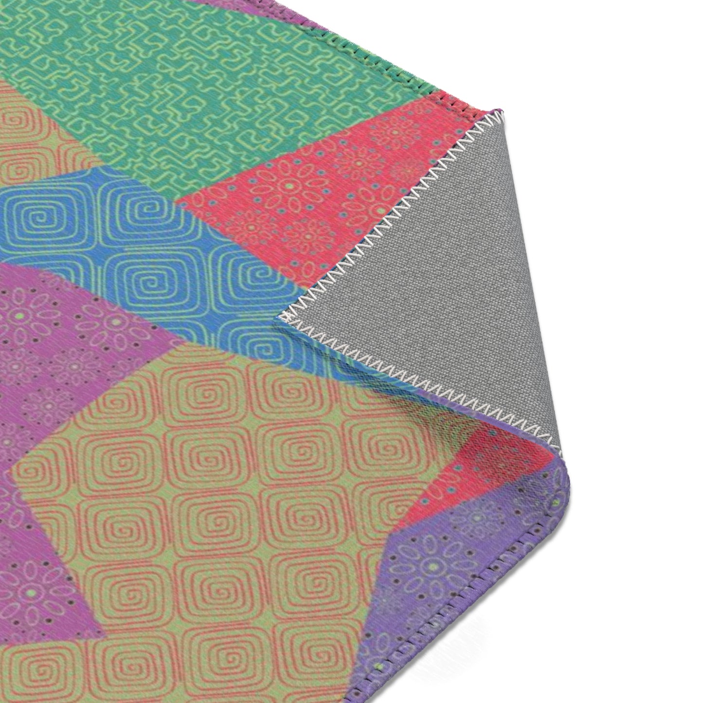 Area rug with colorful abstract cat design on a geometric patterned background