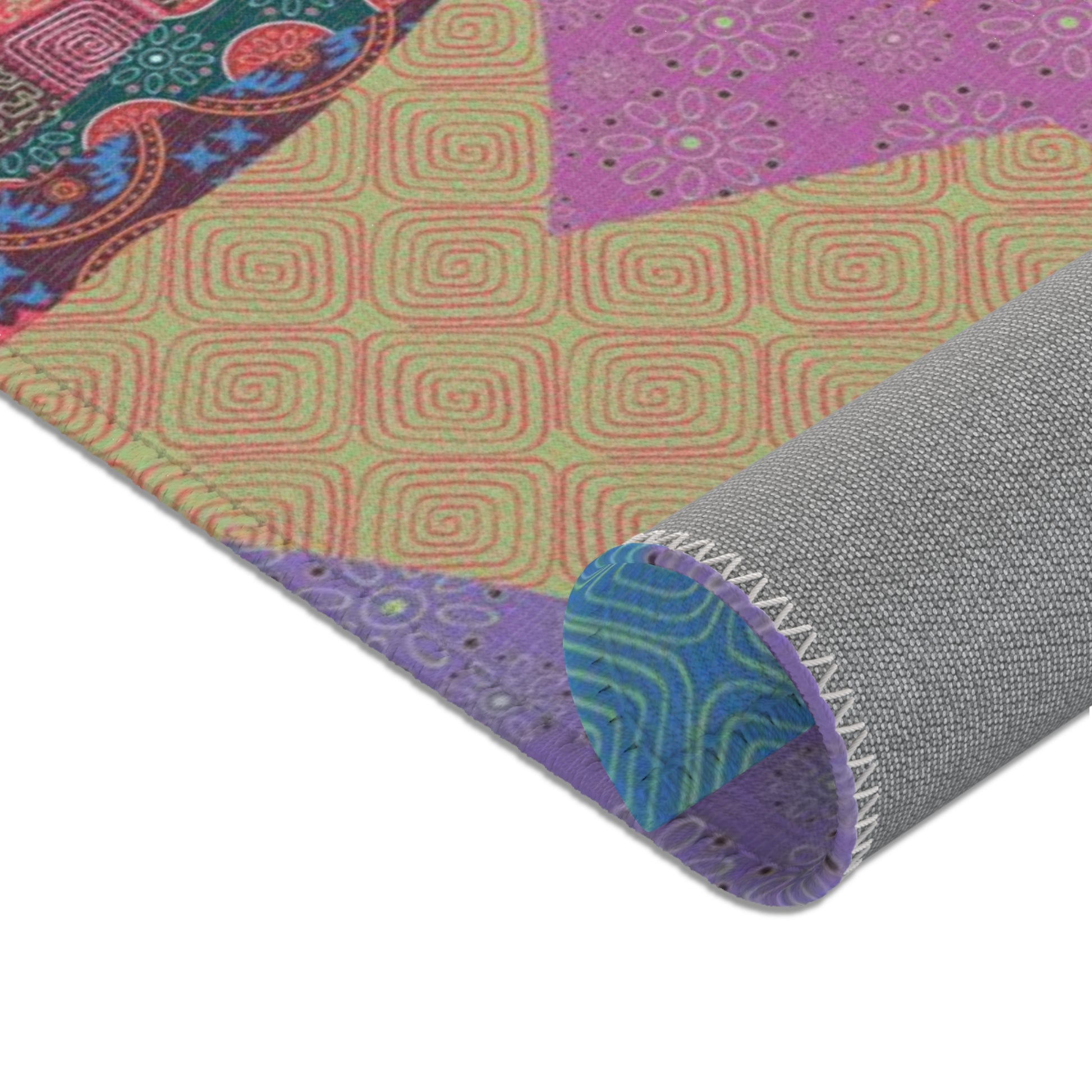 Area rug with colorful abstract cat design on a geometric patterned background