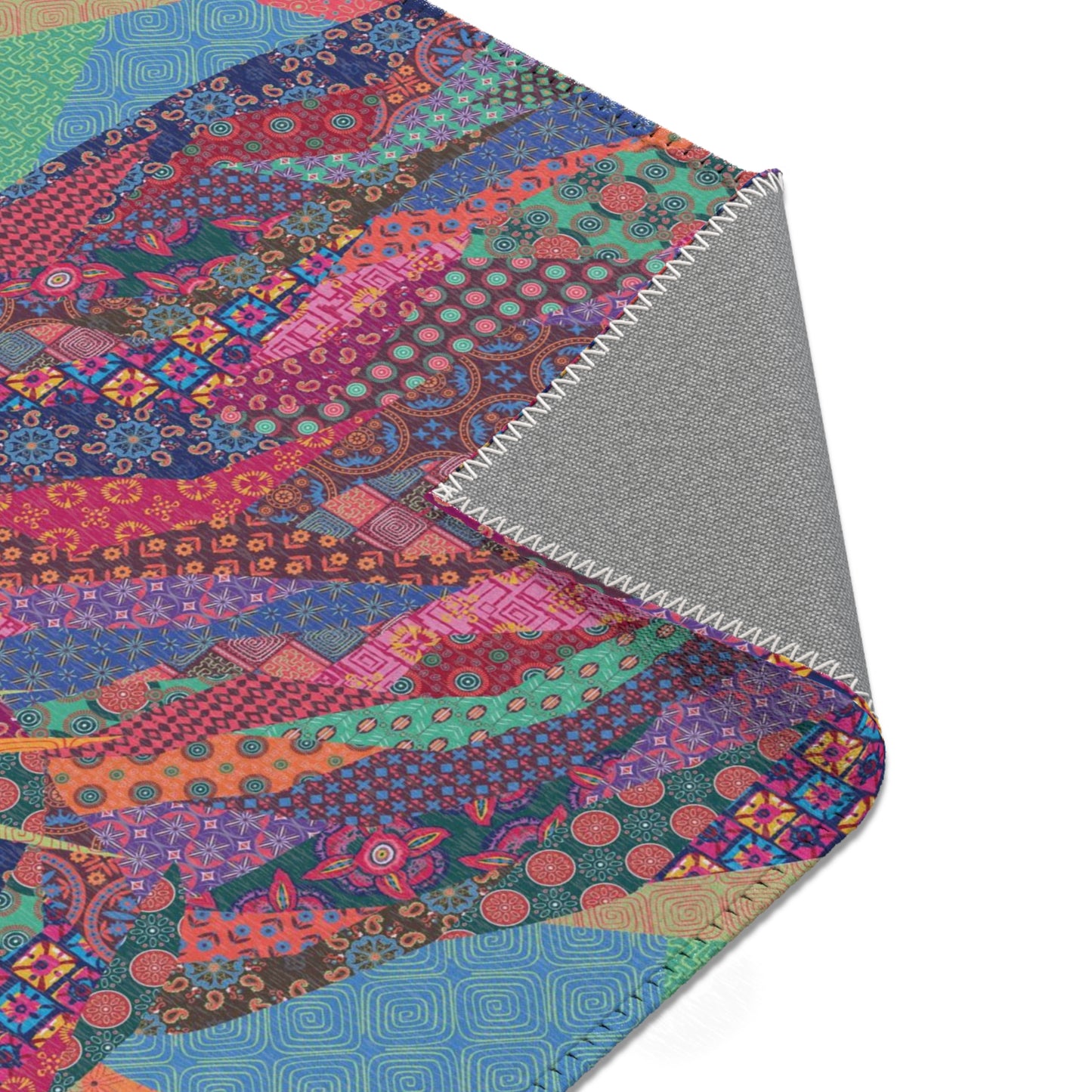 Area rug with colorful abstract cat design on a geometric patterned background