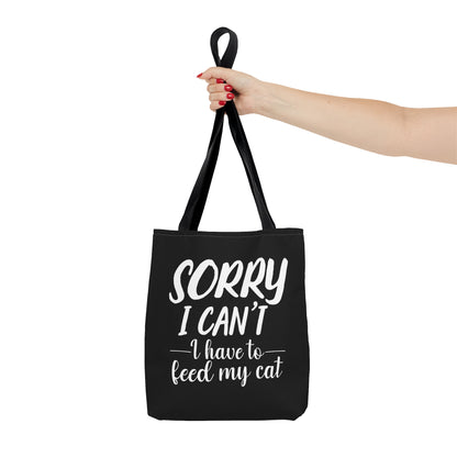 "Sorry I can't i have to feed my cat" black tote bag