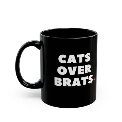Black mug with 'CATS OVER BRATS' text and cat graphic.