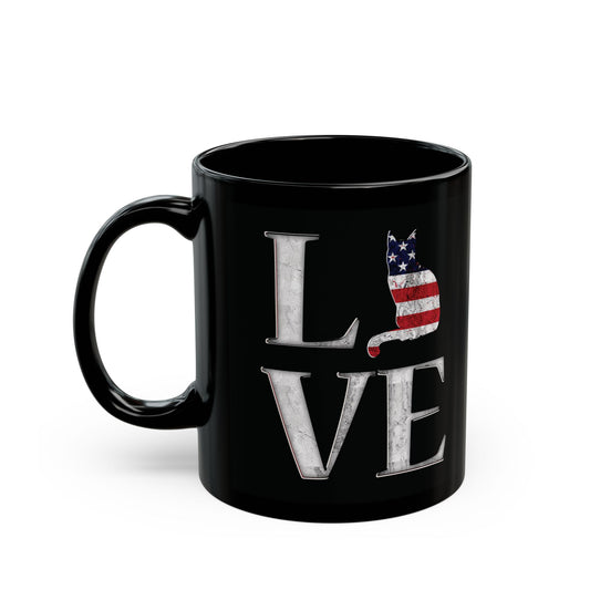 Black mug with 'LOVE' text design featuring a cat silhouette in colors of the American flag.