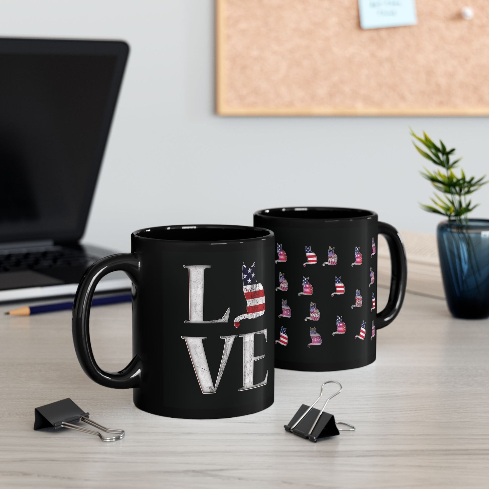 Black mug with 'LOVE' text design featuring a cat silhouette in colors of the American flag.
