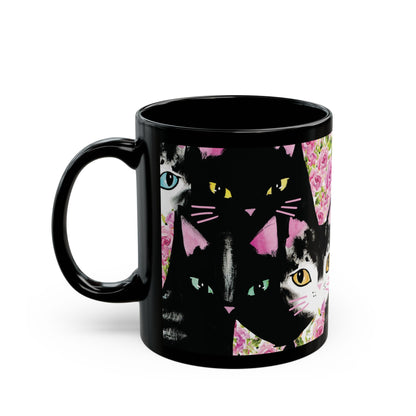 Black mug with a colorful abstract cat design.