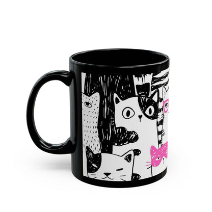 Black mug with cartoon cat illustrations.