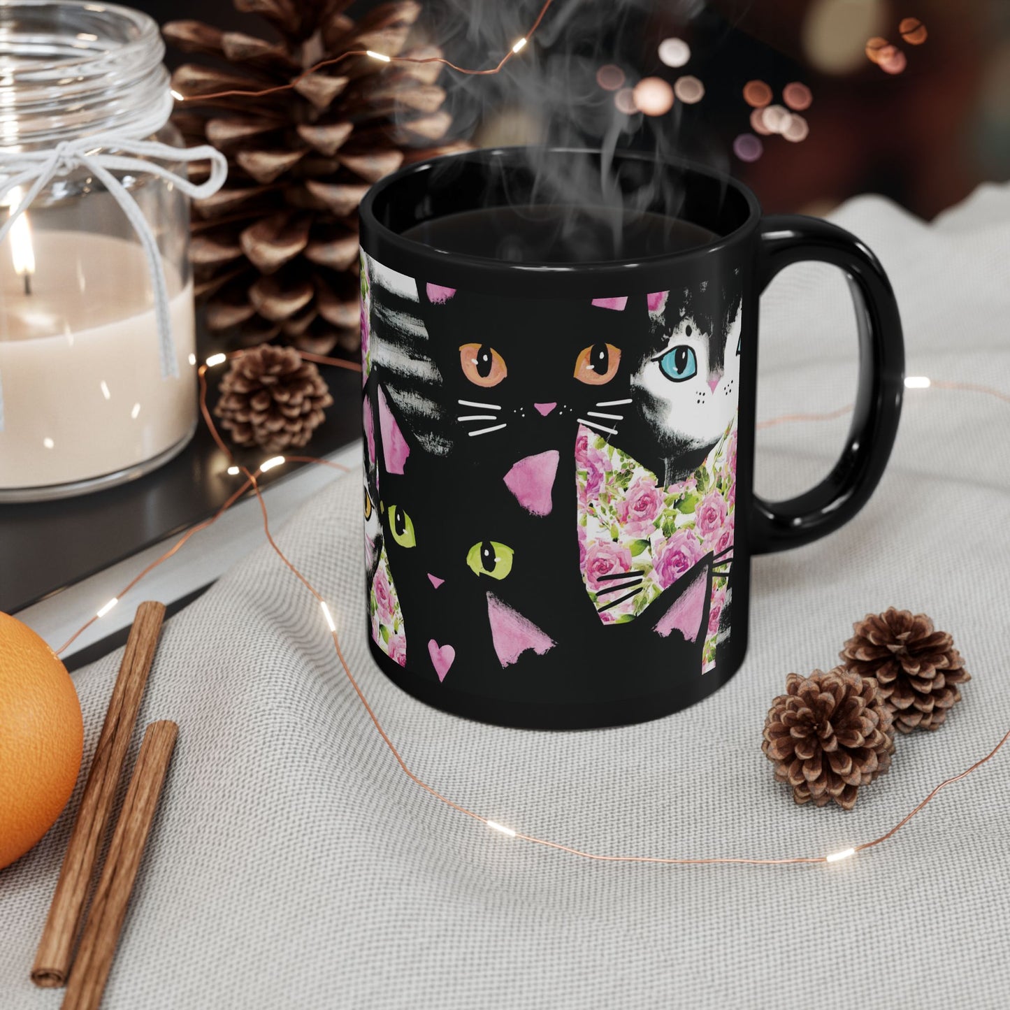 Black mug with a colorful abstract cat design.