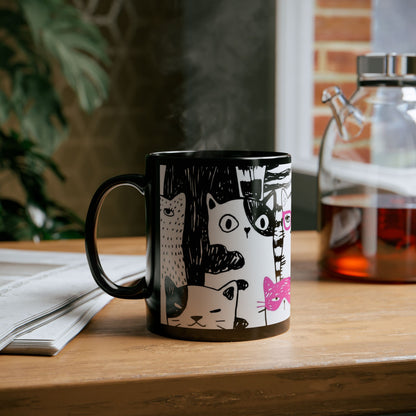 Black mug with cartoon cat illustrations.