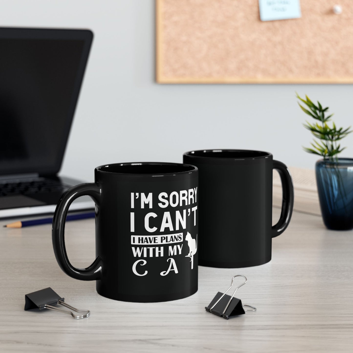 Black mug with white text "I'm Sorry I Can't I Have Plans With My Cat" and a cat graphic.