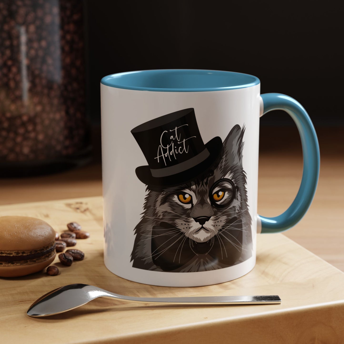 Mug with an illustration of a Maine Coon cat wearing a top hat and the text 'Cat Addict' 