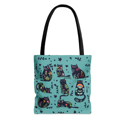 Blue Tote bag with black illustrated cats and flowers pattern.