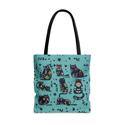 Blue Tote bag with black illustrated cats and flowers pattern.