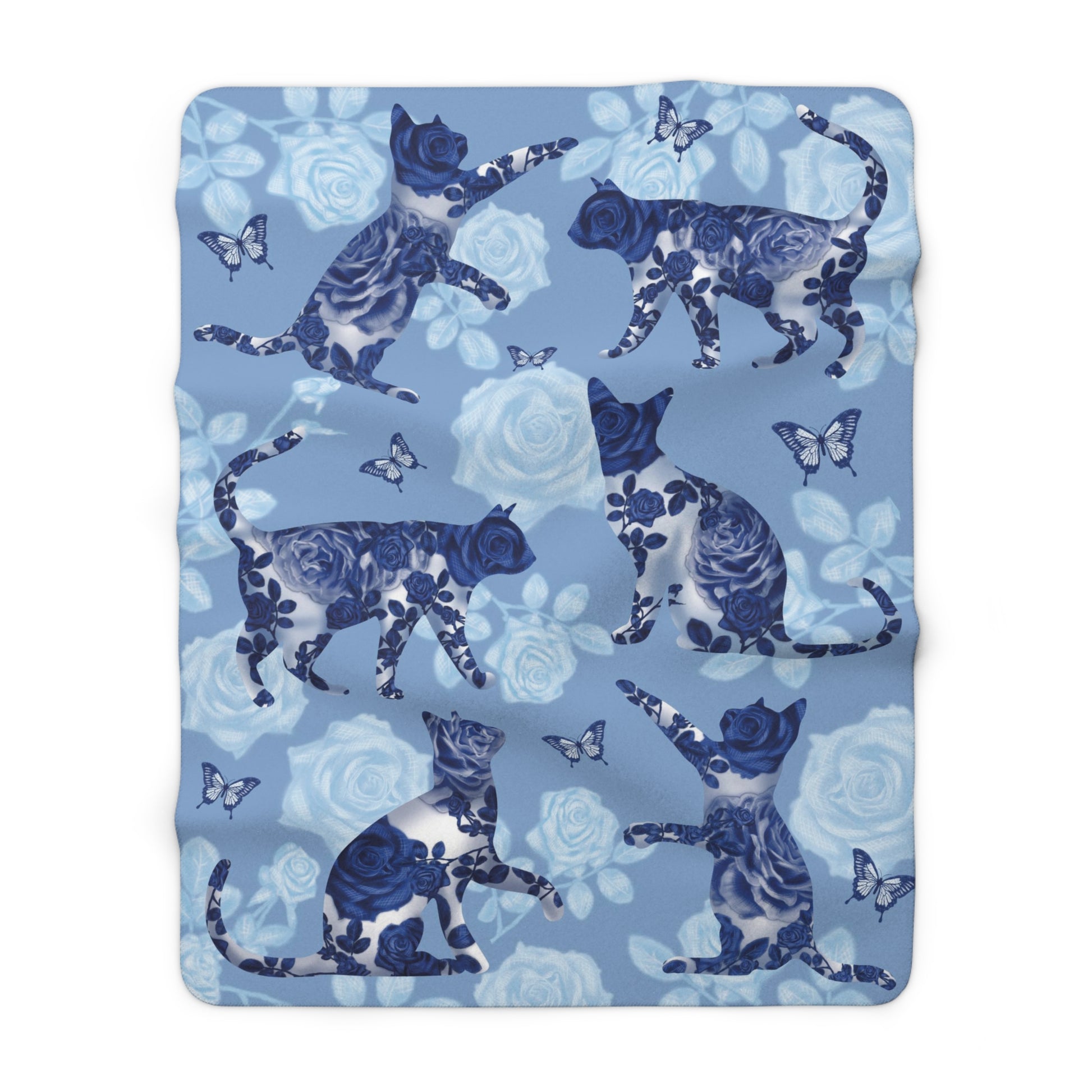 Blue fleece blanket with cats, butterflies and floral pattern.